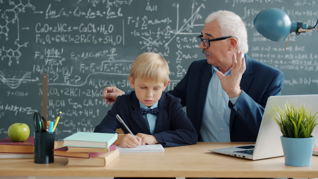 Teacher helping a student with homework in a classroom