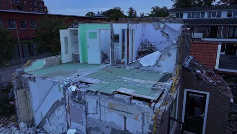 Aerial-reveal-of-badly-destroyed-home,-Hendrik-Ido-Ambacht,-Netherlands