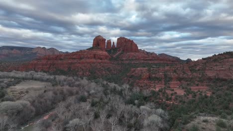 natural sandstone butte cathedral rock in sedona, arizona under cloudy sky at sunset