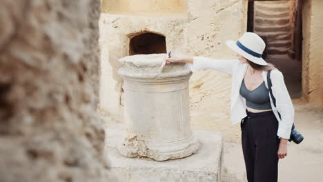 woman exploring ancient ruins