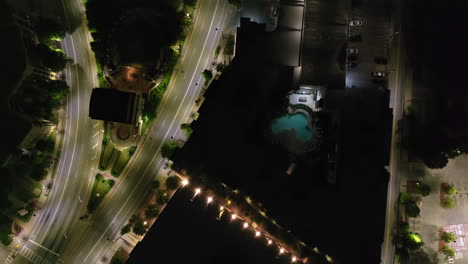 birds eye shot of illuminated streets in urban neighborhood