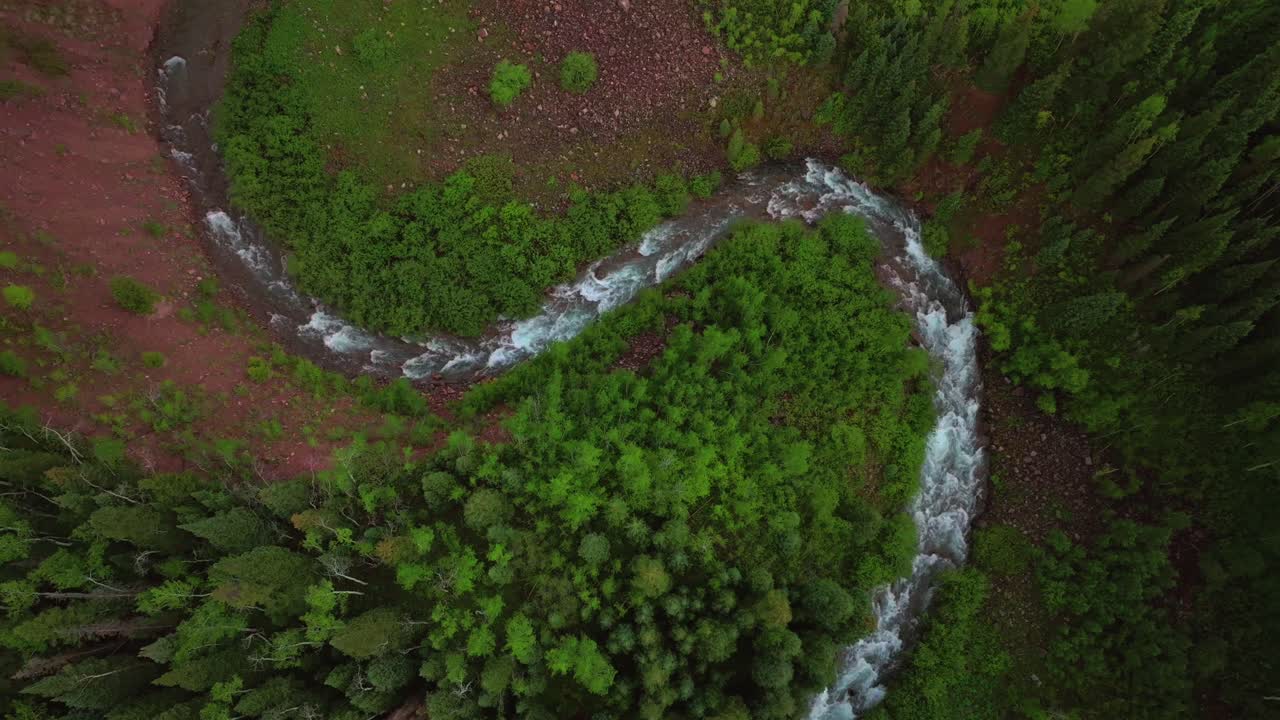 Aspen Snowmass Maroon Creek Roaring Fork Colorado River Maroon Bells Wilderness Rocky Mountains Colorado aerial drone spring summer windy curves White River National Forest afternoon cloudy shade