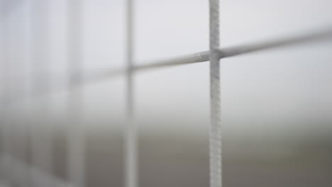 shallow depth of focus of a fence; 50 fps slowed to 25