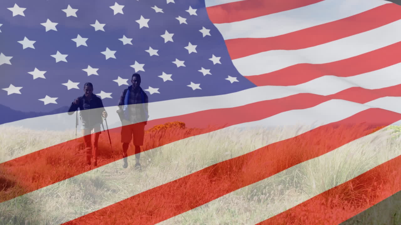 Animation of american flag over african american couple walking in mountains