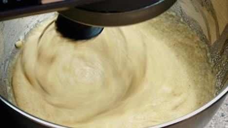 sugar and baking ingredients mixing in metal bowl