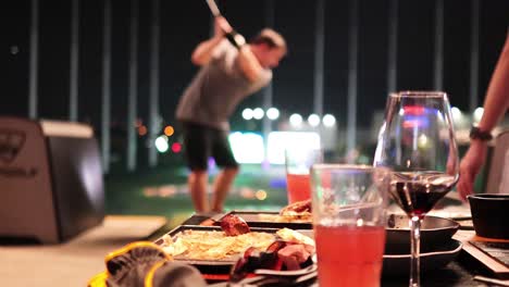 friends enjoying golf and drinks together