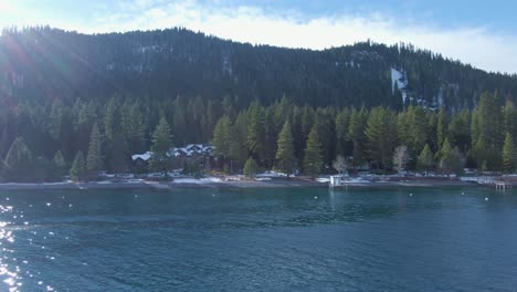 drone truck over lake tahoe fast northern california winter snow capped mountains