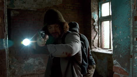 men entering an abandoned building