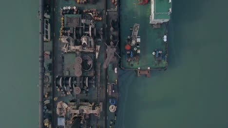 overhead view of sailing cargo vessel with loading equipment in paradeep port, odisha, india