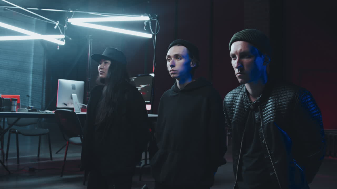 Arrested Criminal Hackers Kneeling on Floor