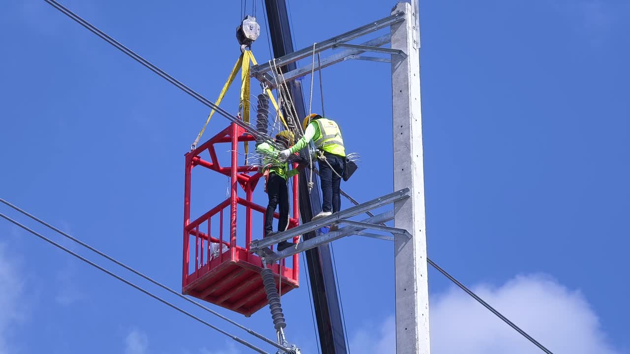 Utility Workers Installing Power Lines