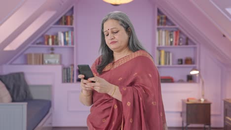 Indian-old-woman-chatting-on-phone