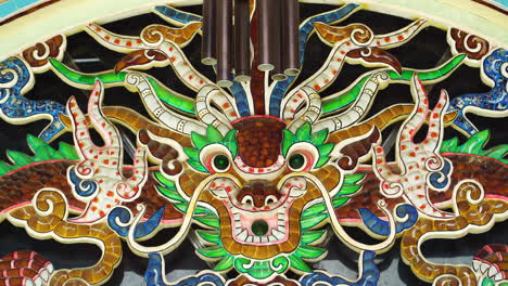 dragon artwork and symbol on buddhist temple in vietnam