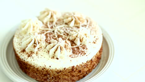 Pumpkin-spice-cake-sitting-on-a-clean-white-counter-during-the-beginning-of-the-fall-season