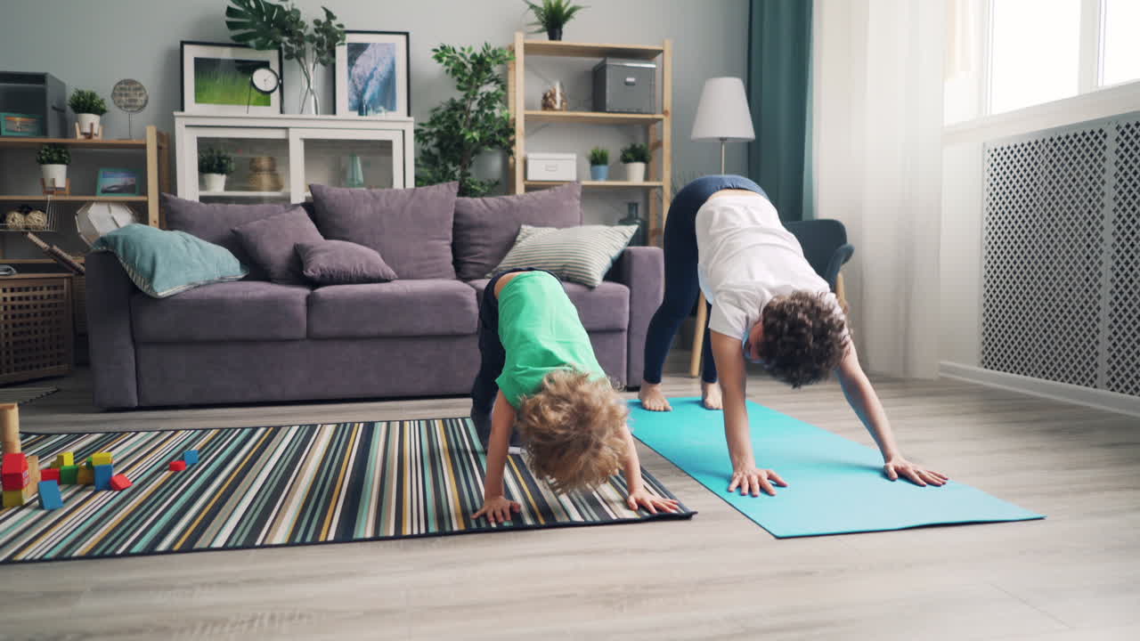 Mother and Son Doing Yoga Together at Home