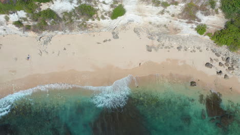 Flyover-beach-top-view-of-amazing-ocean-waves-crushing-on-shore