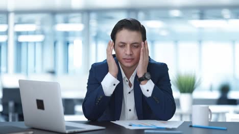 indian businessman getting stressed at work