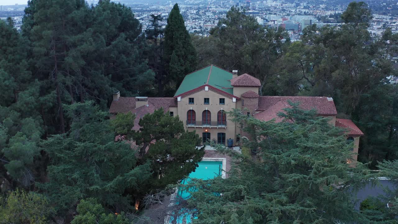 Close-up panning aerial shot flying over the historic Paramour Estate during low light in Hollywood, California. 4K