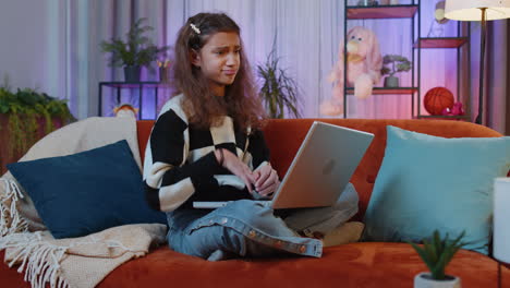 preteen teenager girl use laptop surprised by bad news, fortune loss, fail, lottery results at home