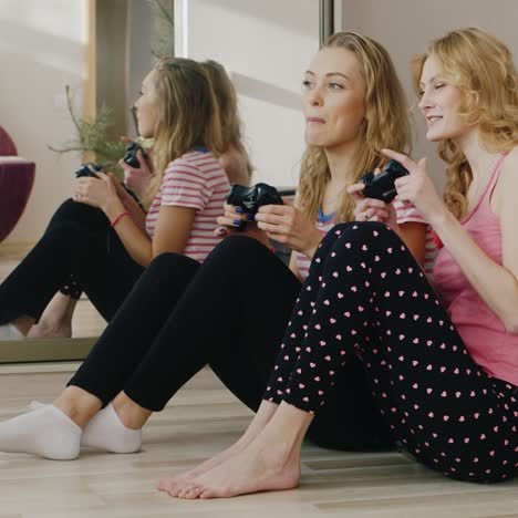 two young women playing on the console