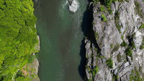 cinematic drone flight over beautiful river valley in nagatoro, japan