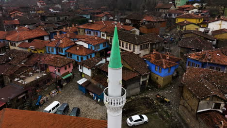 Drone-Orbiting-Over-Mosque-Minaret-In-The-Historical-Village-Of-Cumalikizik-In-Bursa,-Turkiye