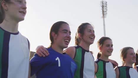 Female-hockey-players-standing-in-a-row-