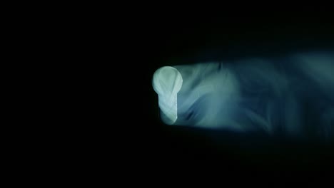 mysterious light through keyhole.