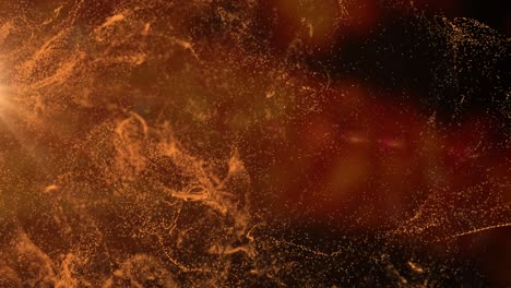 animación de una nube de partículas naranja que se mueve sobre un fondo negro