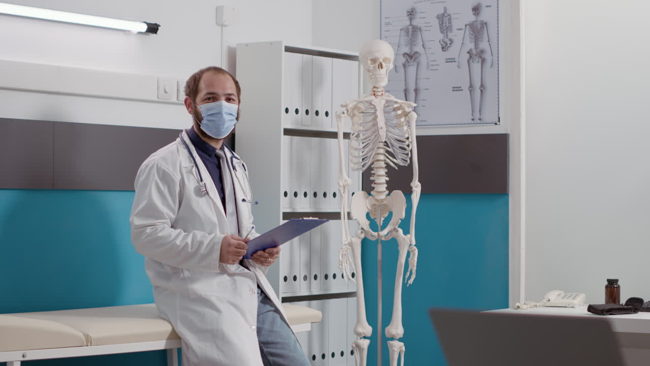 Portrait of general practitioner with white coat and stethoscope
