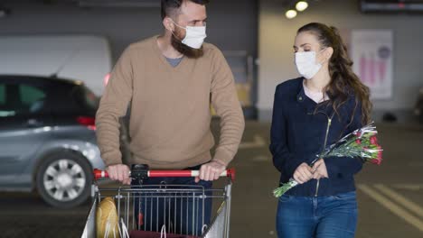 video of couple in protective mask coming back from shopping