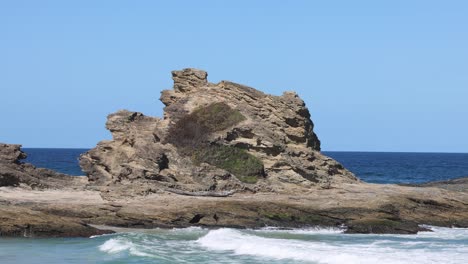 static view of a rock formation by the sea