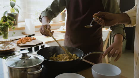 Father and Son Cooking Together in the Kitchen