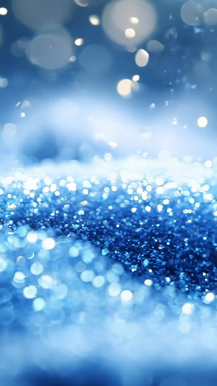 A snow covered hill with a blue sky in the background. The snow is sparkling and the sky is clear