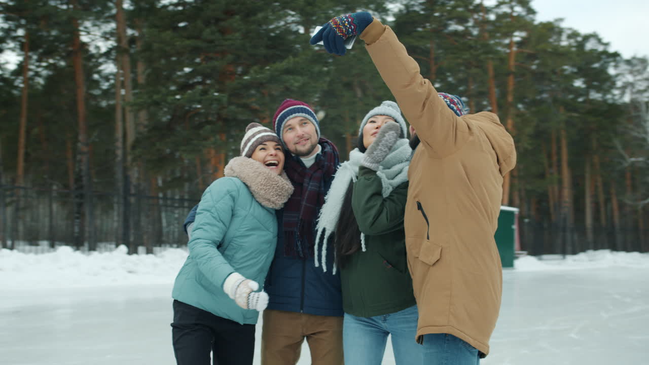 Friends Taking a Selfie at an Ice Rink in Winter