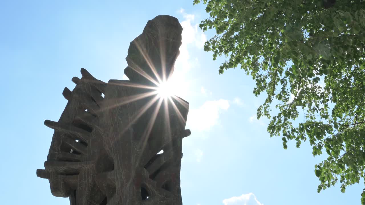 Mihai Eminescu sculpture in Chisinau, Moldova with the blue sky on the background