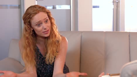 casual businesswoman speaking with psychologist