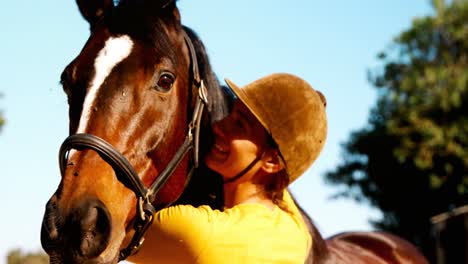 woman standing with the horse in the ranch 4k