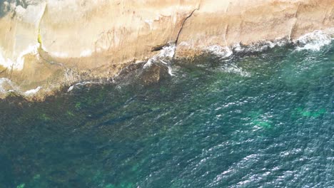Drop-down-view-of-the-calm-ocean-on-south-coast-of-Australia-by-drone