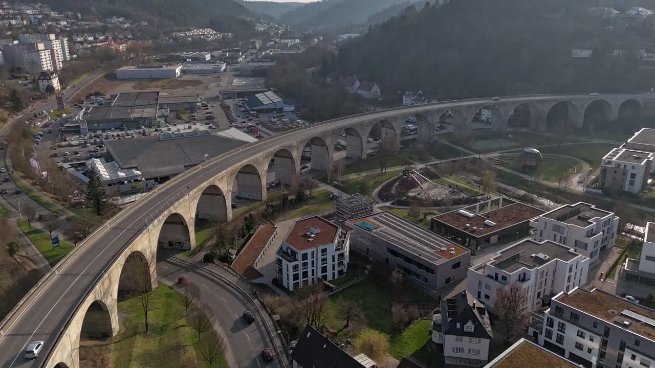 Aerial View of a City with a Long Stone Arch Bridge