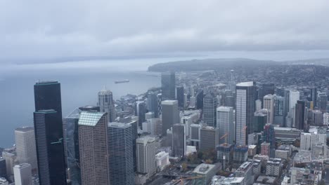 Orbiting-aerial-shot-of-Seattle's-dreary-downtown-buildings