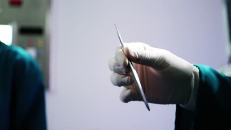 close-up of surgeons performing operation in operation room