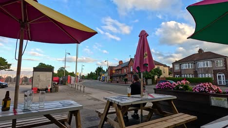 street view of a cafe with umbrellas