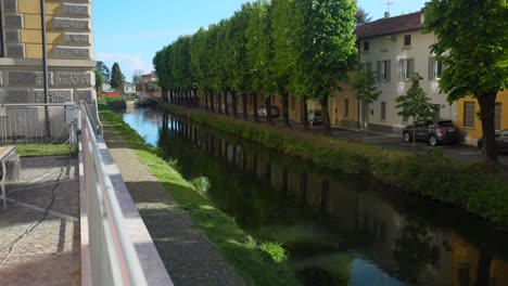 water canals next to trees and a temple in soncino italy