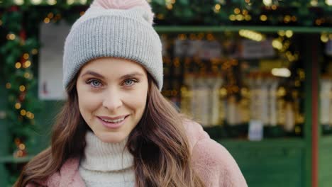 handheld view of young woman in winter clothes