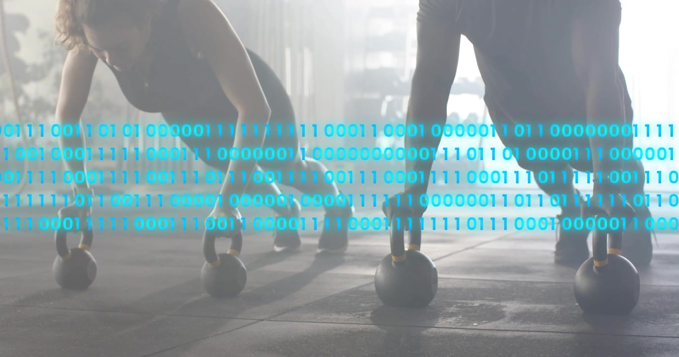 Training partners performing kettlebell push-ups while binary code overlay appearing for fitness