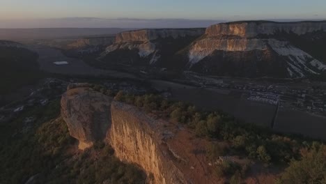 aerial view of mountainous valley at sunset