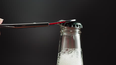 opening a bottle of soda