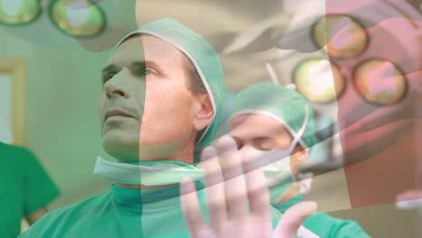 animation of flag of italy over caucasian doctors with face masks