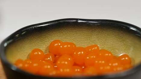 orange candies in a bowl